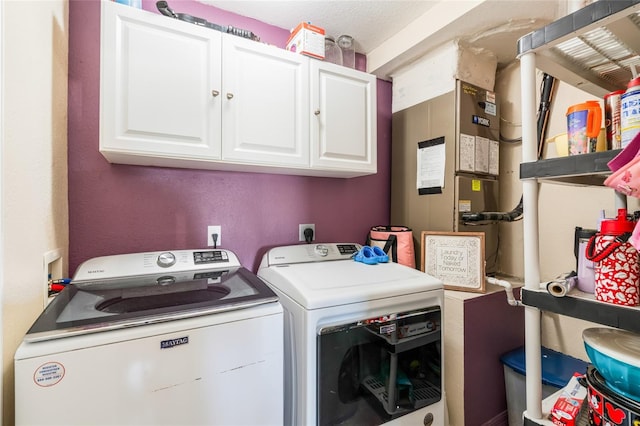 6178 Coliseum Blvd, Port Charlotte, FL 33981 - washroom with washer and dryer, cabinet space, and heating unit