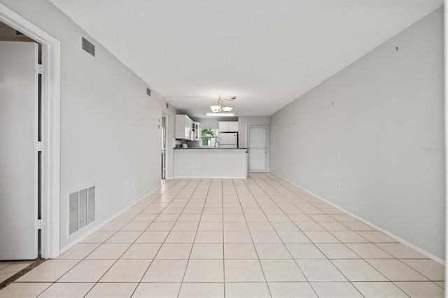 25100 Sandhill Blvd Unit 104G, Punta Gorda, FL 33983 - unfurnished living room with a chandelier and a sink