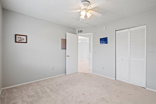 25100 Sandhill Blvd Unit 104G, Punta Gorda, FL 33983 - unfurnished bedroom with carpet floors, a closet, and ceiling fan