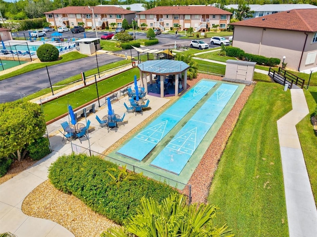 25100 Sandhill Blvd Unit 104G, Punta Gorda, FL 33983 - view of community featuring shuffleboard, a yard, and a residential view