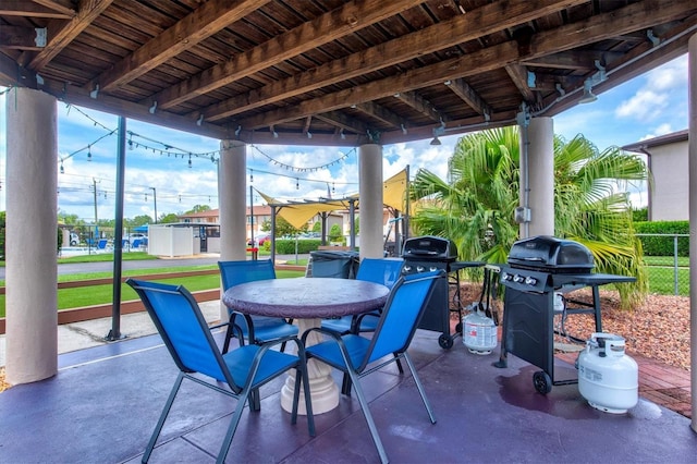 25100 Sandhill Blvd Unit 104G, Punta Gorda, FL 33983 - view of patio with grilling area and outdoor dining space
