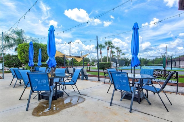 25100 Sandhill Blvd Unit 104G, Punta Gorda, FL 33983 - view of patio / terrace with a tennis court and outdoor dining area