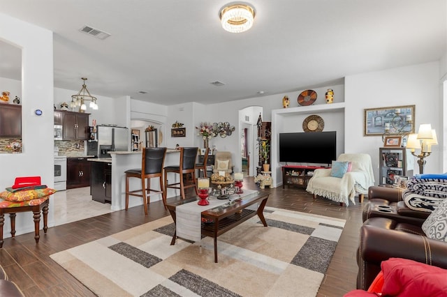 25324 Alicante Dr, Punta Gorda, FL 33955 - living room with arched walkways and light wood-style flooring