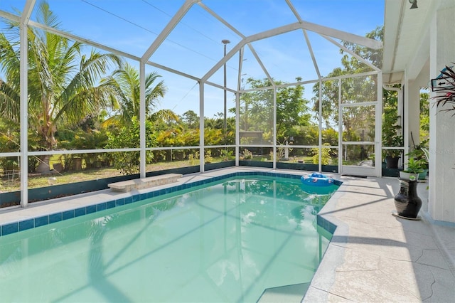 25324 Alicante Dr, Punta Gorda, FL 33955 - outdoor pool featuring glass enclosure and a patio area