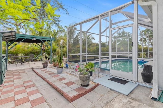 25324 Alicante Dr, Punta Gorda, FL 33955 - swimming pool featuring a patio area, outdoor dining space, and glass enclosure