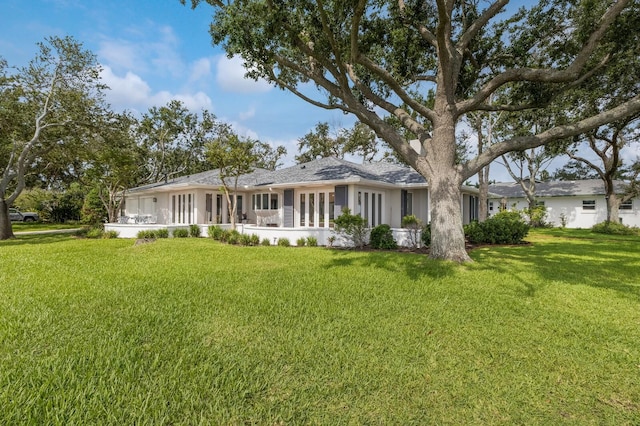 2401 Riverview Blvd, Bradenton, FL 34205 - view of front facade with a front yard and stucco siding