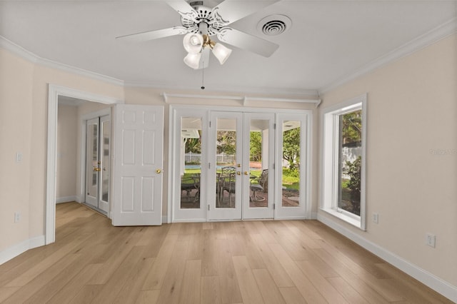 2401 Riverview Blvd, Bradenton, FL 34205 - spare room with french doors, ornamental molding, light wood-style floors, and ceiling fan