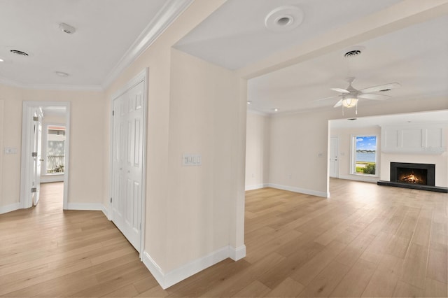 2401 Riverview Blvd, Bradenton, FL 34205 - hallway featuring light wood finished floors and ornamental molding