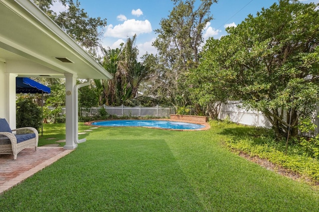 2401 Riverview Blvd, Bradenton, FL 34205 - fenced backyard with a patio area