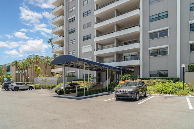 1400 1st Ave W Unit 103, Bradenton, FL 34205 - view of apartment building / complex with uncovered parking