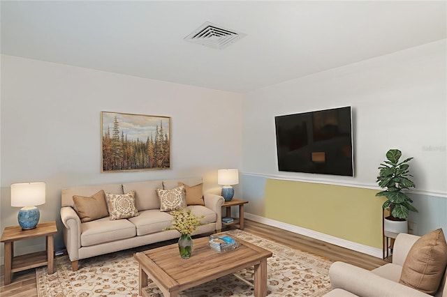 1400 1st Ave W Unit 103, Bradenton, FL 34205 - living area with wood finished floors and baseboards