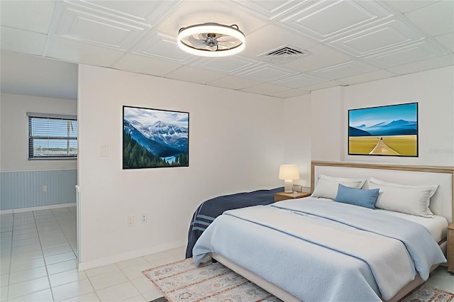 1400 1st Ave W Unit 103, Bradenton, FL 34205 - bedroom with light tile patterned flooring, an ornate ceiling, and wainscoting
