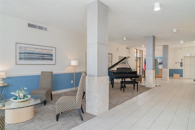 1400 1st Ave W Unit 103, Bradenton, FL 34205 - common area with a textured ceiling