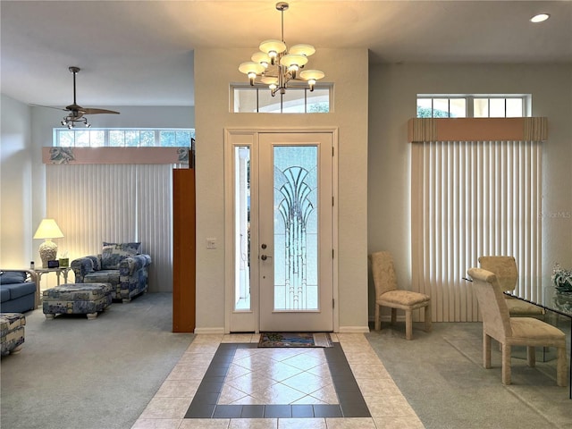 8616 15th Ave NW, Bradenton, FL 34209 - carpeted foyer entrance with tile patterned floors, a chandelier, healthy amount of natural light, and recessed lighting