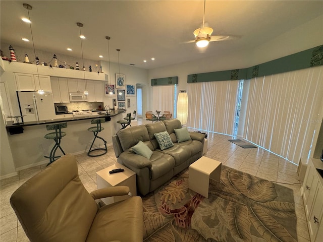 8616 15th Ave NW, Bradenton, FL 34209 - living room with light tile patterned floors, ceiling fan, and recessed lighting