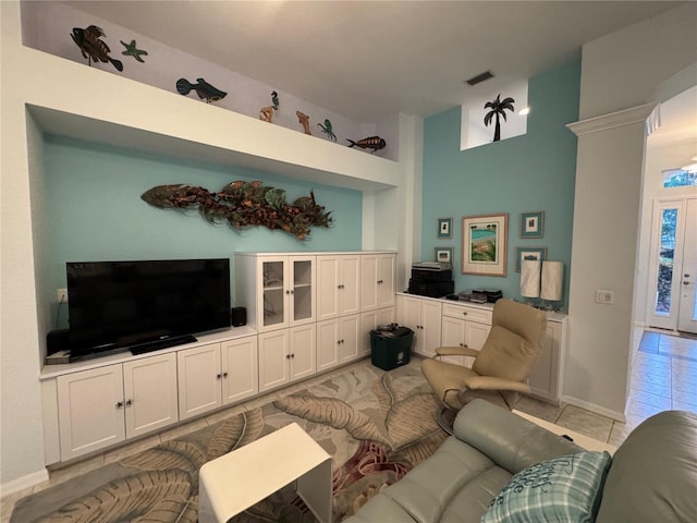 8616 15th Ave NW, Bradenton, FL 34209 - living room with light tile patterned floors and a high ceiling