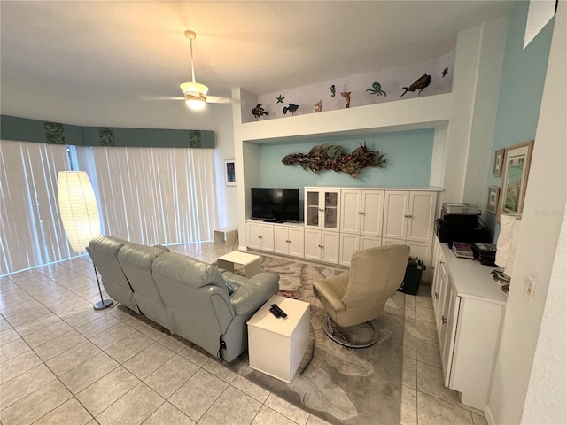 8616 15th Ave NW, Bradenton, FL 34209 - living area featuring light tile patterned floors, a ceiling fan, and built in shelves