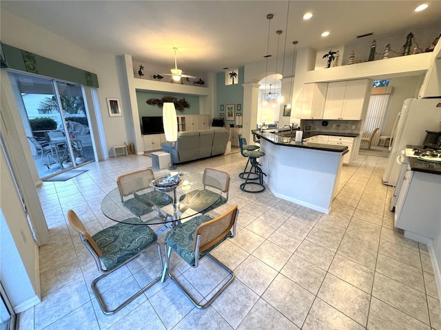 8616 15th Ave NW, Bradenton, FL 34209 - dining room featuring a ceiling fan, light tile patterned floors, and recessed lighting