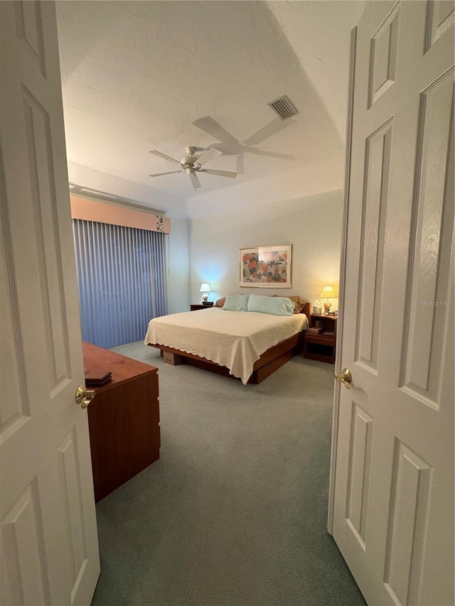 8616 15th Ave NW, Bradenton, FL 34209 - bedroom featuring carpet flooring, a textured ceiling, and a ceiling fan
