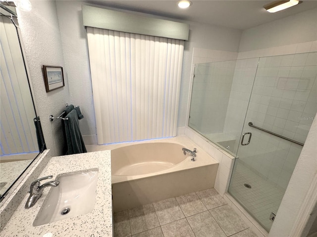 8616 15th Ave NW, Bradenton, FL 34209 - bathroom with a bath, a shower stall, vanity, tile patterned flooring, and recessed lighting