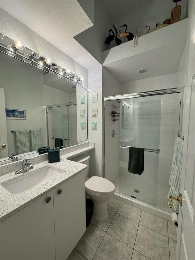 8616 15th Ave NW, Bradenton, FL 34209 - full bathroom with a shower stall, vanity, and tile patterned flooring