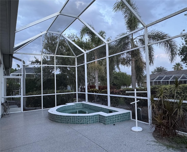 8616 15th Ave NW, Bradenton, FL 34209 - view of patio / terrace featuring glass enclosure and a pool with connected hot tub