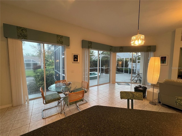 8616 15th Ave NW, Bradenton, FL 34209 - dining area featuring tile patterned flooring and a chandelier
