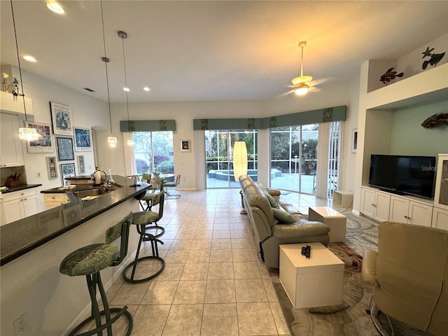 8616 15th Ave NW, Bradenton, FL 34209 - living room featuring healthy amount of natural light, light tile patterned flooring, a ceiling fan, and recessed lighting