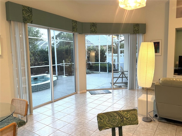 8616 15th Ave NW, Bradenton, FL 34209 - doorway to outside featuring light tile patterned floors and healthy amount of natural light