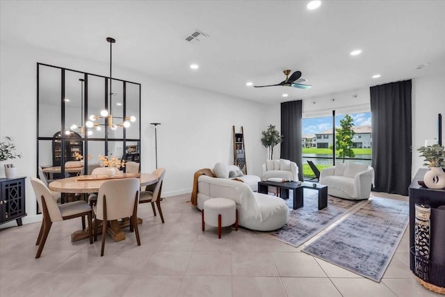 15131 Sunny Day Dr, Bradenton, FL 34211 - living area featuring recessed lighting, light tile patterned floors, ceiling fan, and a chandelier