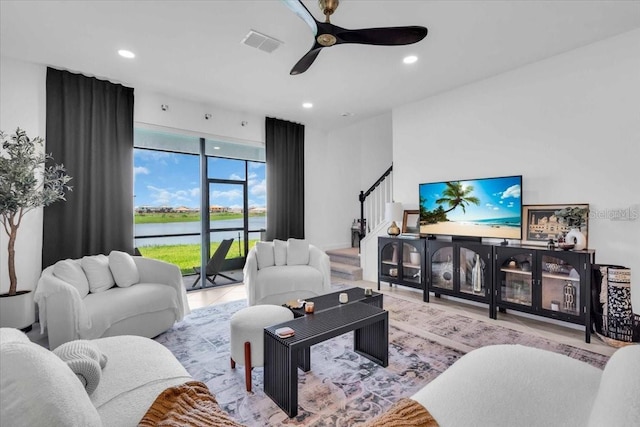 15131 Sunny Day Dr, Bradenton, FL 34211 - living room with stairs, ceiling fan, and recessed lighting