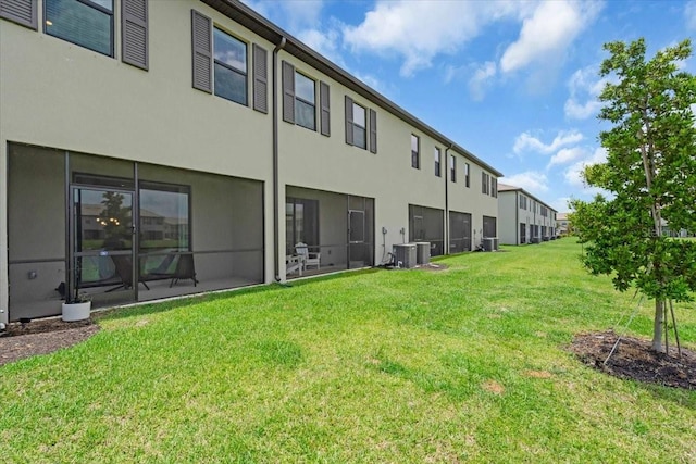 15131 Sunny Day Dr, Bradenton, FL 34211 - back of house featuring a yard and stucco siding