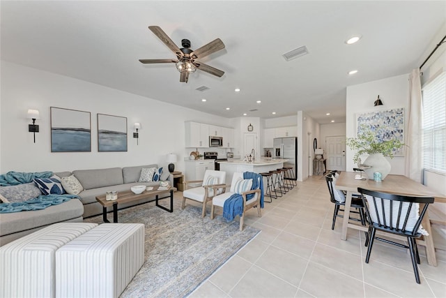 5711 Archipelago St, Nokomis, FL 34275 - living room featuring a ceiling fan, light tile patterned floors, and recessed lighting