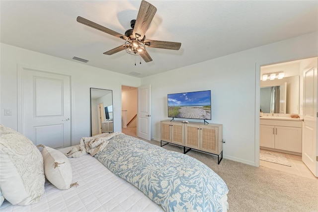 5711 Archipelago St, Nokomis, FL 34275 - bedroom with light colored carpet, a ceiling fan, and ensuite bath