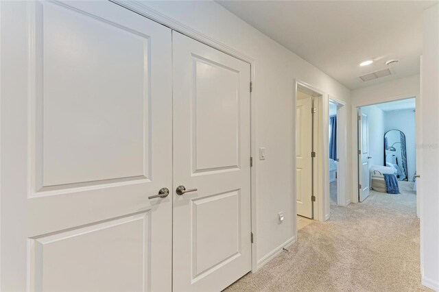 5711 Archipelago St, Nokomis, FL 34275 - hallway featuring light carpet and baseboards