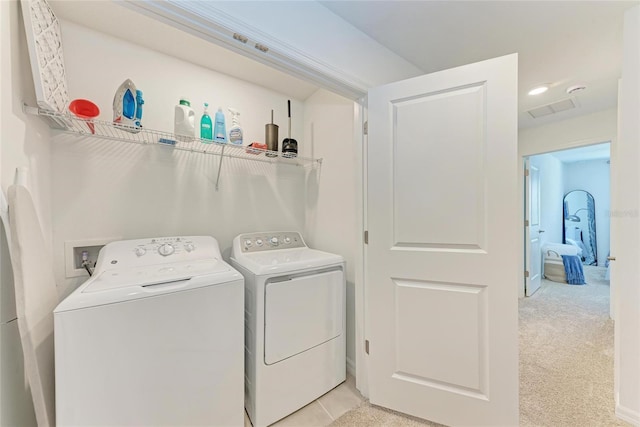 5711 Archipelago St, Nokomis, FL 34275 - laundry area featuring washer and clothes dryer and light colored carpet