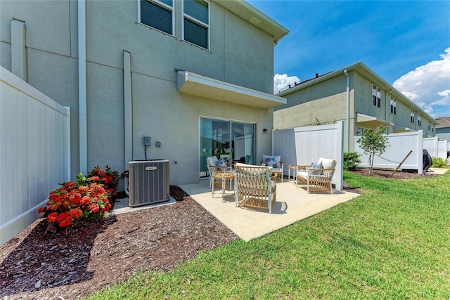 5711 Archipelago St, Nokomis, FL 34275 - rear view of property with stucco siding, a patio, and outdoor lounge area