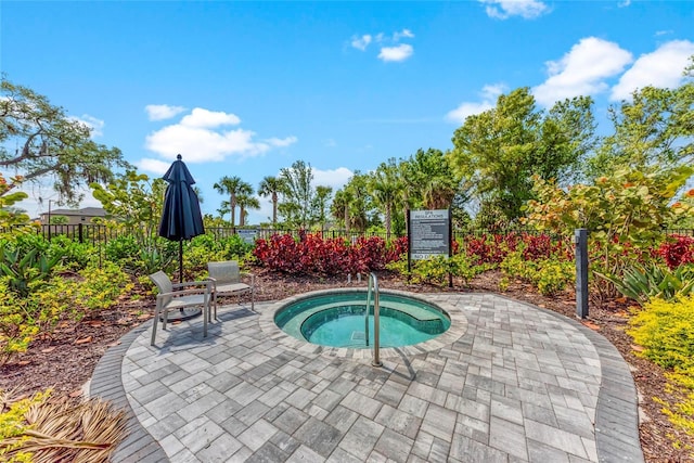 5711 Archipelago St, Nokomis, FL 34275 - view of swimming pool featuring a hot tub and a patio area