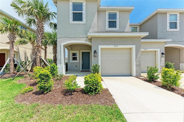 5711 Archipelago St, Nokomis, FL 34275 - view of front of house featuring stucco siding, driveway, and a garage