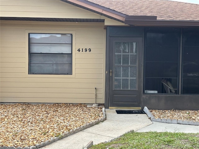 4199 66th Street Cir W Unit 4199, Bradenton, FL 34209 - view of exterior entry with a shingled roof