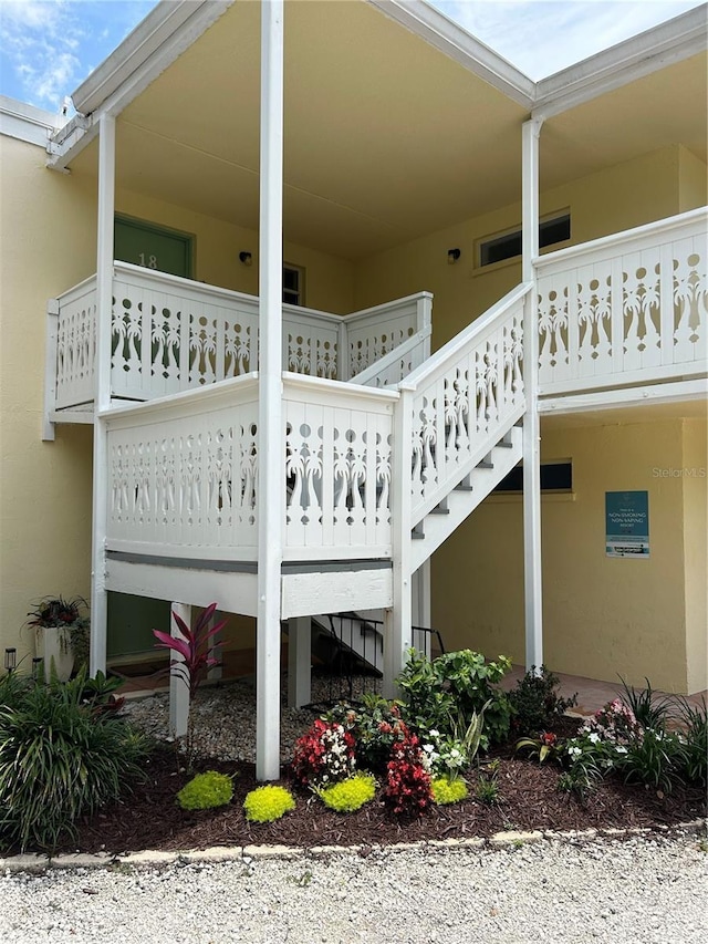 5310 Gulf Of Mexico Dr Unit 18, Longboat Key, FL 34228 - view of home's exterior with stairs and stucco siding