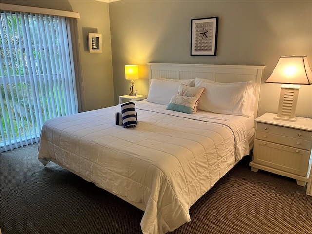 5310 Gulf Of Mexico Dr Unit 18, Longboat Key, FL 34228 - bedroom featuring dark carpet