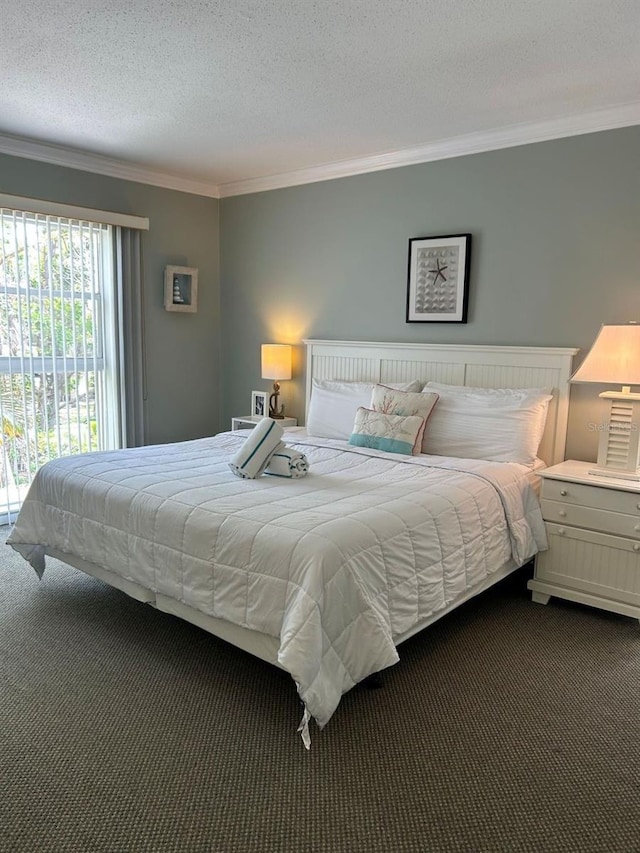 5310 Gulf Of Mexico Dr Unit 18, Longboat Key, FL 34228 - bedroom with ornamental molding, dark carpet, access to outside, and a textured ceiling