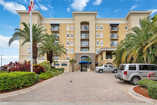 1064 N Tamiami Trl Unit 1125, Sarasota, FL 34236 - view of apartment building / complex featuring uncovered parking