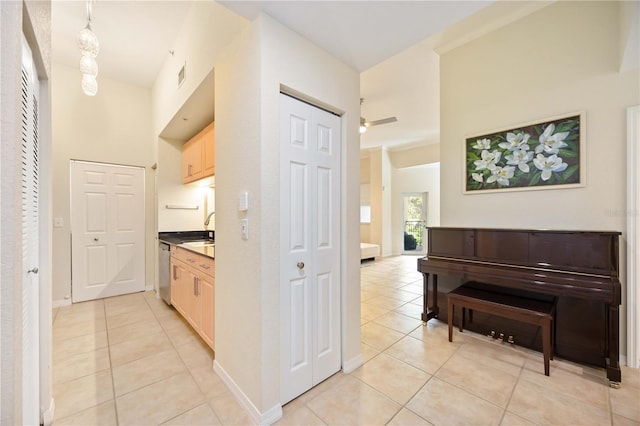 1064 N Tamiami Trl Unit 1125, Sarasota, FL 34236 - hallway with light tile patterned flooring and a towering ceiling