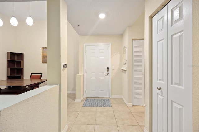 1064 N Tamiami Trl Unit 1125, Sarasota, FL 34236 - entrance foyer featuring light tile patterned floors and baseboards