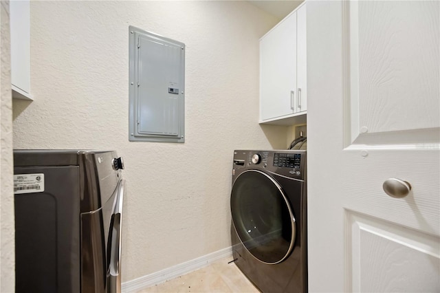 1064 N Tamiami Trl Unit 1125, Sarasota, FL 34236 - washroom featuring electric panel, cabinet space, and separate washer and dryer