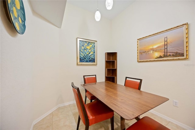 1064 N Tamiami Trl Unit 1125, Sarasota, FL 34236 - dining room featuring baseboards and light tile patterned floors