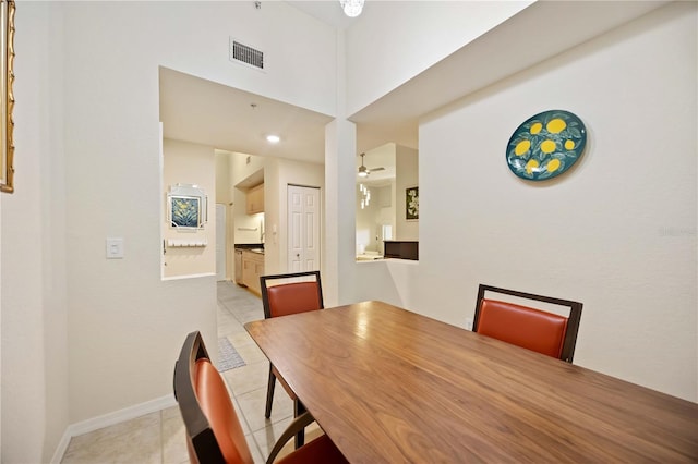 1064 N Tamiami Trl Unit 1125, Sarasota, FL 34236 - dining space with light tile patterned floors and ceiling fan