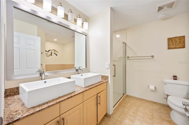 1064 N Tamiami Trl Unit 1125, Sarasota, FL 34236 - bathroom with a shower stall, double vanity, and tile patterned floors
